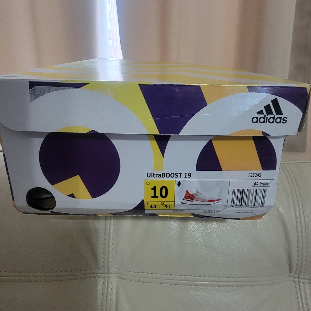 Adidas UltraBOOST 19 Running Shoe Cream, Orange, And Black.